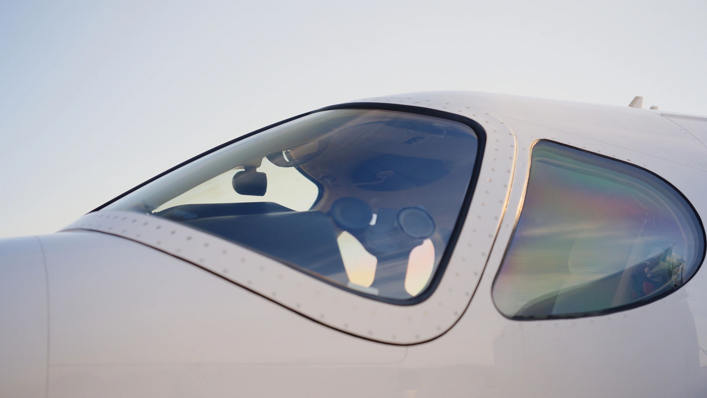 Private jet cockpit viewed from outside